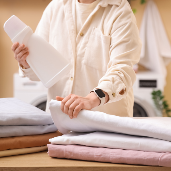 woman folding linens